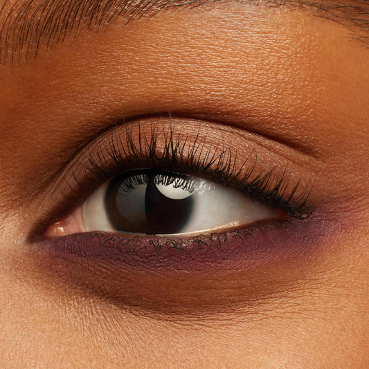 Eye showcases Charmer Crème Gel Liner gliding along the waterline and lower lash line, a rich plum shade with a creamy semi-matte finish, shown as a beauty swatch for the ColourPop Crème Gel Liner.