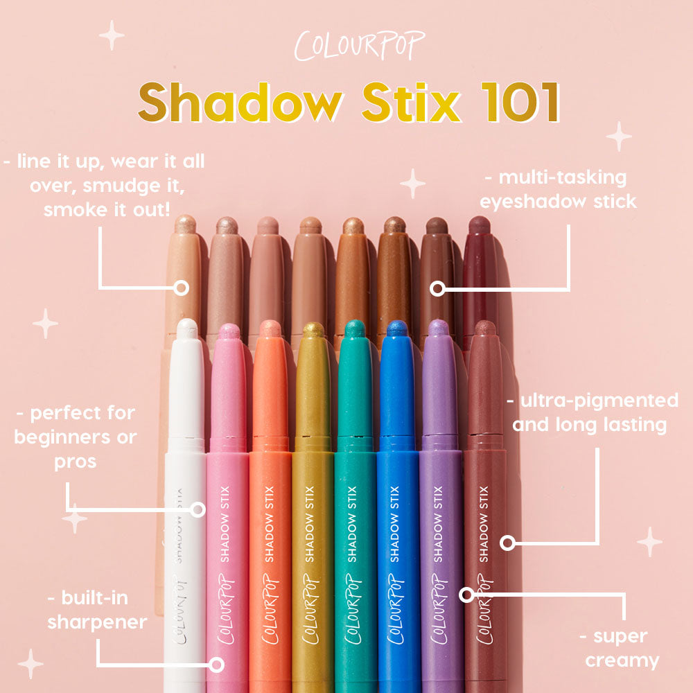 Flex ColourPop Shadow Stix eyeshadow stick shown tip-up beside a rainbow lineup on a blush pink background, spotlighting a creamy, ultraβpigmented, longβwear, multiβtasking formula with a builtβin sharpener for beginners or pros.