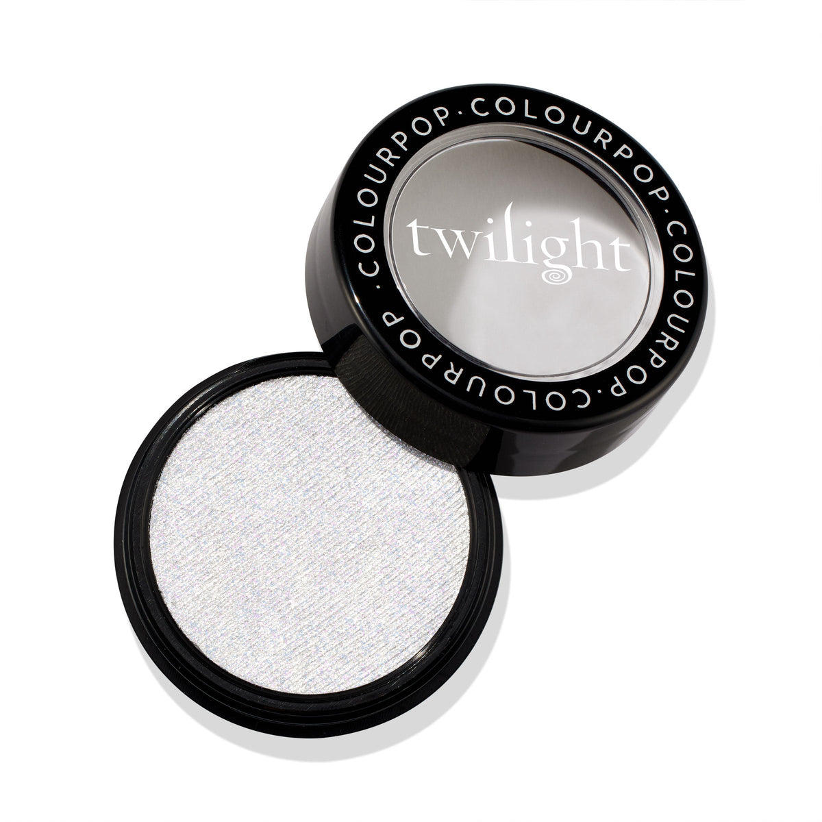 Vampire Skin ColourPop Super Shock Highlighter opens to reveal an icy white micro-shimmer pan in a round black compact with a clear window lid stamped “twilight,” resting on a clean white background.