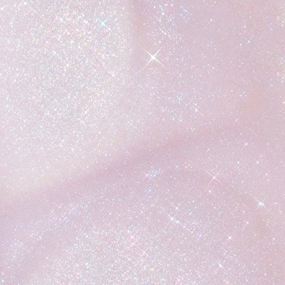 Opaltini SOL Shimmering Dry Oil swatch glistening with iridescent opal-pink microglitter across a soft pastel background, showcasing the radiant skin finish of ColourPop SOL Shimmering Dry Oil.