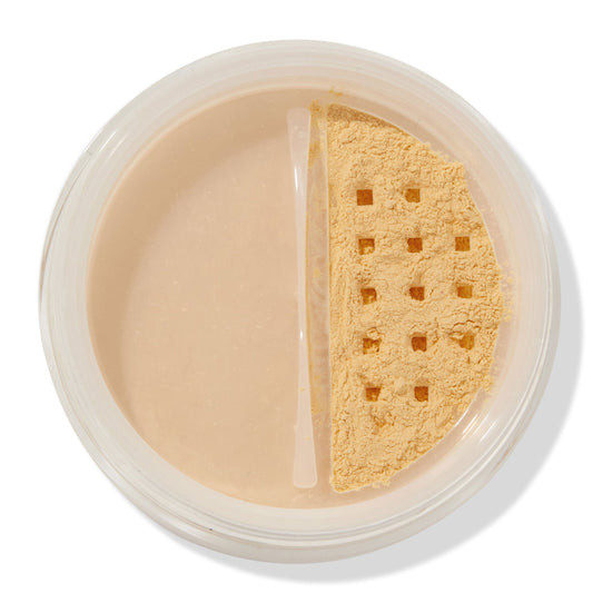 ColourPop No Filter Loose Setting Powder in Banana shown open, yellow-toned powder visible through a square-holed sifter in a clear round jar on a white background, used for brightening and setting makeup.