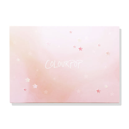 ColourPop Stars Large Empty Palette closed and front-facing, displaying a pink ombré lid sprinkled with star graphics and the COLOURPOP logo on a white backdrop; ColourPop Empty Palette for customizing shades.