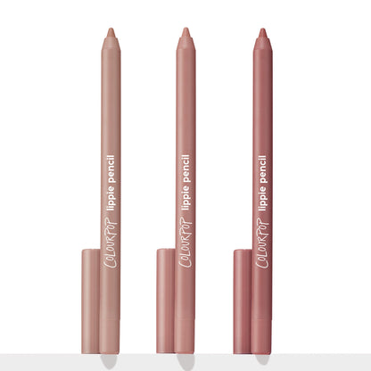 Three ColourPop Lippie Pencil liners from the Cool Besties set stand upright with caps at the base, tips exposed in light beige nude, soft pink nude, and rosy mauve shades against a white studio background.