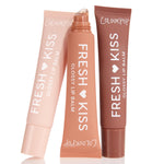 Sweet Treats ColourPop Glossy Lip Balm Trio standing in a fan: three Fresh Kiss squeeze tubes in blush pink, peach, and cocoa, center tube uncapped showing slanted applicator, set against a clean white background.