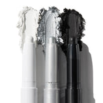 ColourPop Shadow Stix Totally Wicked trio shows uncapped pencils with rich swatches - matte white, metallic silver, and matte black - smeared behind each tip on a white background for bold smoky or graphic eye looks.