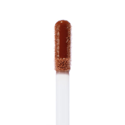 Doe-foot applicator swatched with Coffee Break, a warm coffee-brown Ultra Glossy Lip, showing high-shine, smooth texture and precise tip; ColourPop Ultra Glossy Lip wand isolated on a white background.