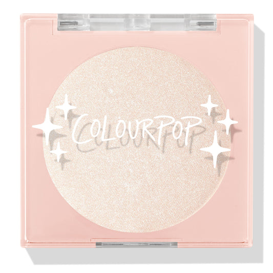 Cold One highlighter compact showcasing a shimmering icy pearl pan behind a clear lid with white sparkle icons and ColourPop logo, closed in a blush‑pink square case on a white background; ColourPop Pressed Powder Highlighter.