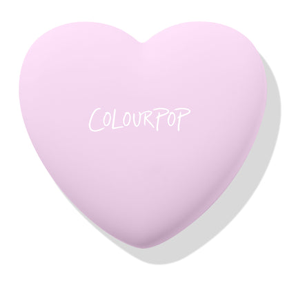 Cupid’s Bow ColourPop Pressed Powder Blush compact closed - pastel lavender heart-shaped case with white COLOURPOP logo, angled on a clean white background with a soft shadow.