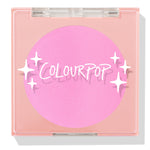 ColourPop Pressed Powder Blush in Flamingo shows a vibrant hot pink pan inside a square peach compact with a clear lid and white sparkles logo, closed and travel-friendly on a light background.