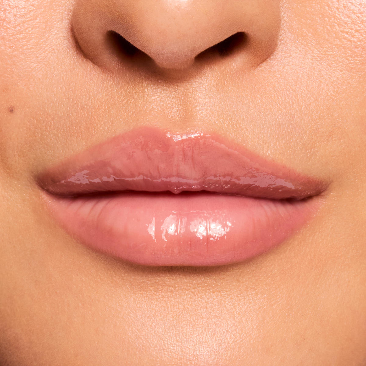 Glossy lips wearing a sheer pink tint, demonstrating the Fruit Basket ColourPop Glossy Lip Balm Trio with high-shine, cushioned moisture and smooth texture; macro close-up in studio lighting highlights hydrated, natural-looking lips.