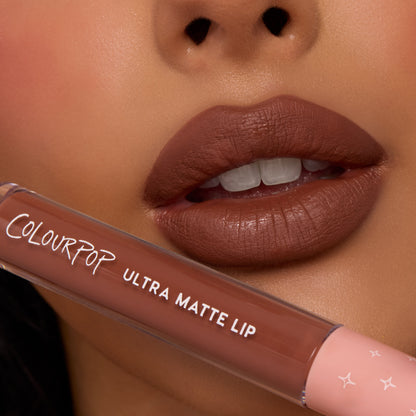 Full lips showcase Espresso Martini, a rich mocha-brown shade with a soft, diffused matte finish, while a ColourPop tube rests below; ColourPop Ultra Blotted Lip delivers lightweight, blurred color for everyday wear.
