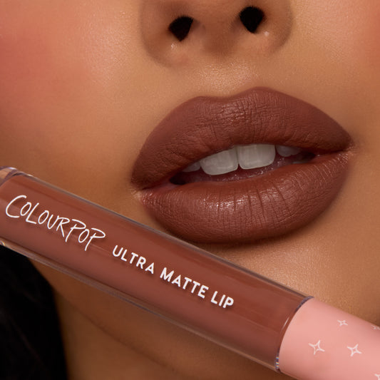 Full lips showcase Espresso Martini, a rich mocha-brown shade with a soft, diffused matte finish, while a ColourPop tube rests below; ColourPop Ultra Blotted Lip delivers lightweight, blurred color for everyday wear.
