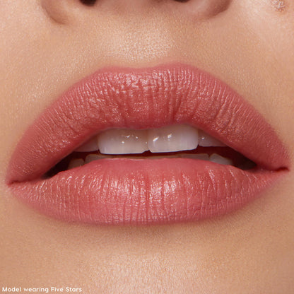 Full lips outlined and lightly filled with ColourPop Lippie Pencil Pinky Promise, a creamy rose-pink lip liner, in a tight close-up showing smooth definition and a soft semi-matte finish.