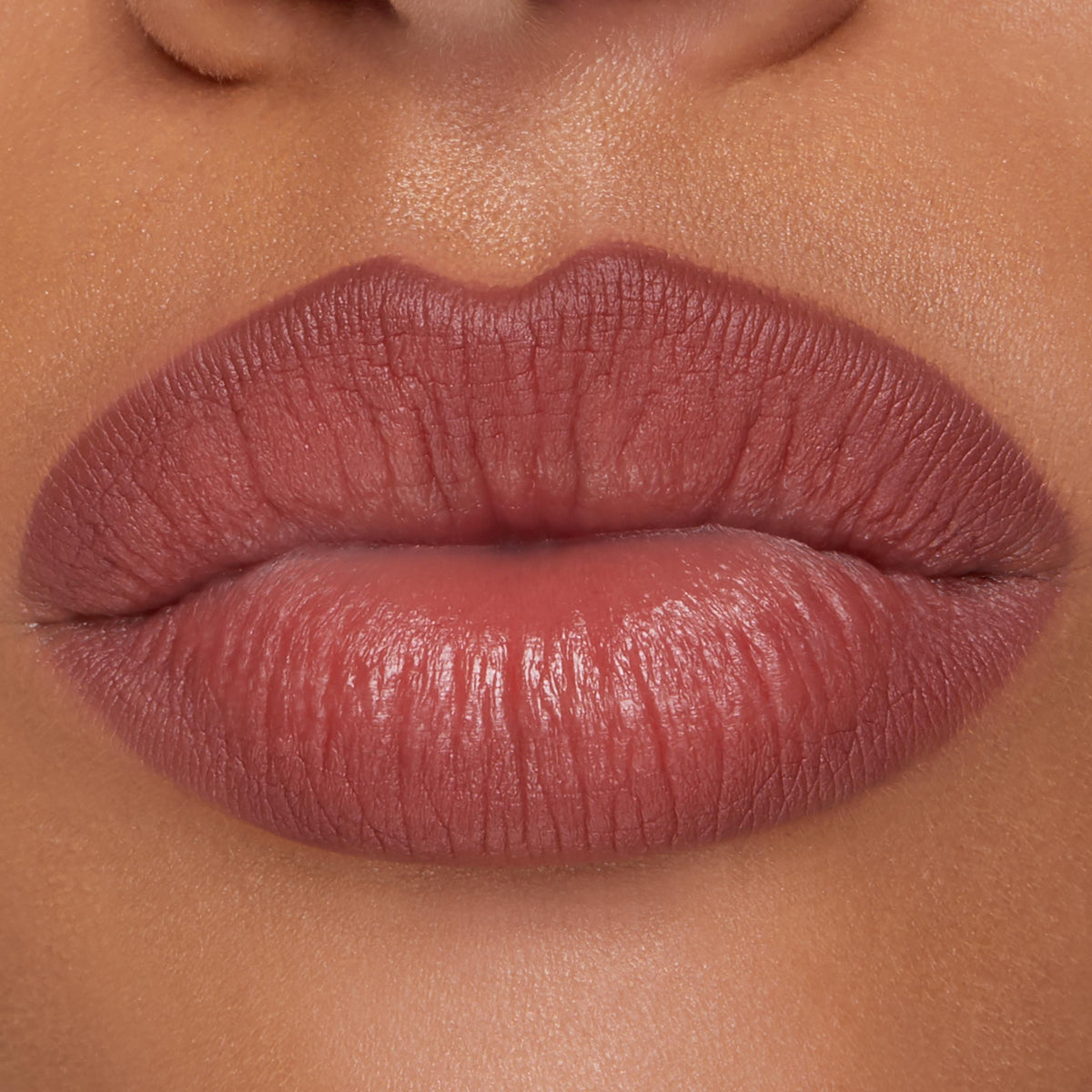 Full lips lined and filled with ColourPop Lippie Pencil in Double Tap, showing a smooth, rosy-mauve hue with defined edges and a soft satin finish in a studio close-up, highlighting precise application for everyday wear.