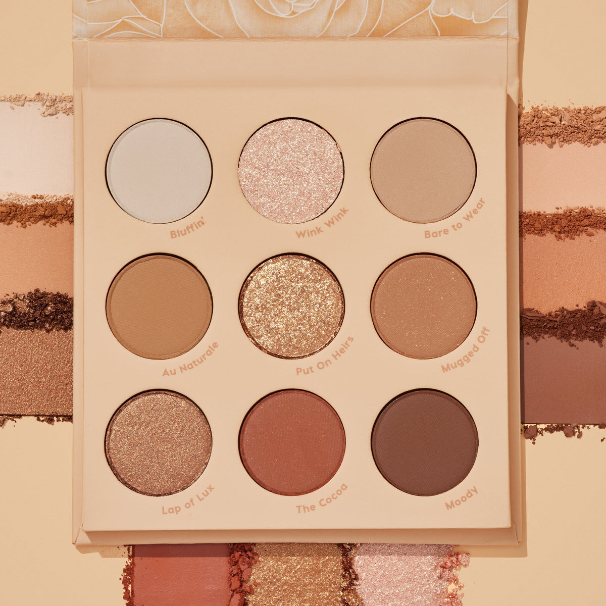 ColourPop Blushing Nude shadow palette set opens to nine neutral pans - matte and shimmer shades like Bluffin’, Wink Wink, and The Cocoa - shown with coordinating swatches surrounding the compact in warm beige, rose, and cocoa tones.