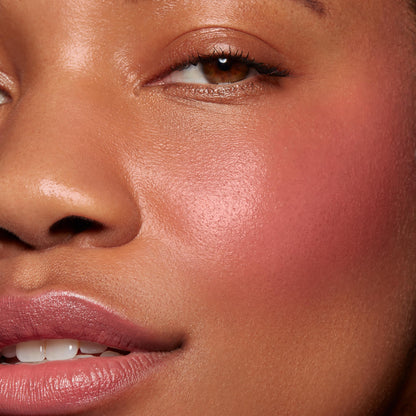 Second Date ColourPop Lip and Cheek Balm adding a dewy rosy‑pink flush to the cheek and a soft glossy tint on lips, shown in a close-up to highlight smooth, hydrated skin and buildable color payoff.