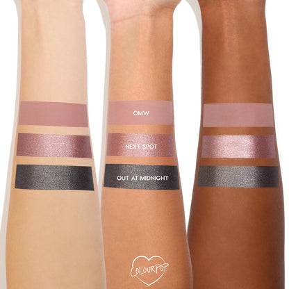 Next Spot shimmering rose ColourPop Shadow Stix swatched on three arms, placed between matte mauve OMW and sparkly charcoal Out at Midnight, showcasing metallic pink payoff across light, medium, and deep skin tones.