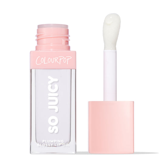 ColourPop So Juicy Plumping Glossy Lip Oil in Lychee Jelly shown open, clear square tube with blush‑pink cap and COLOURPOP branding, doe‑foot applicator holding a translucent gloss bead against a white studio background.