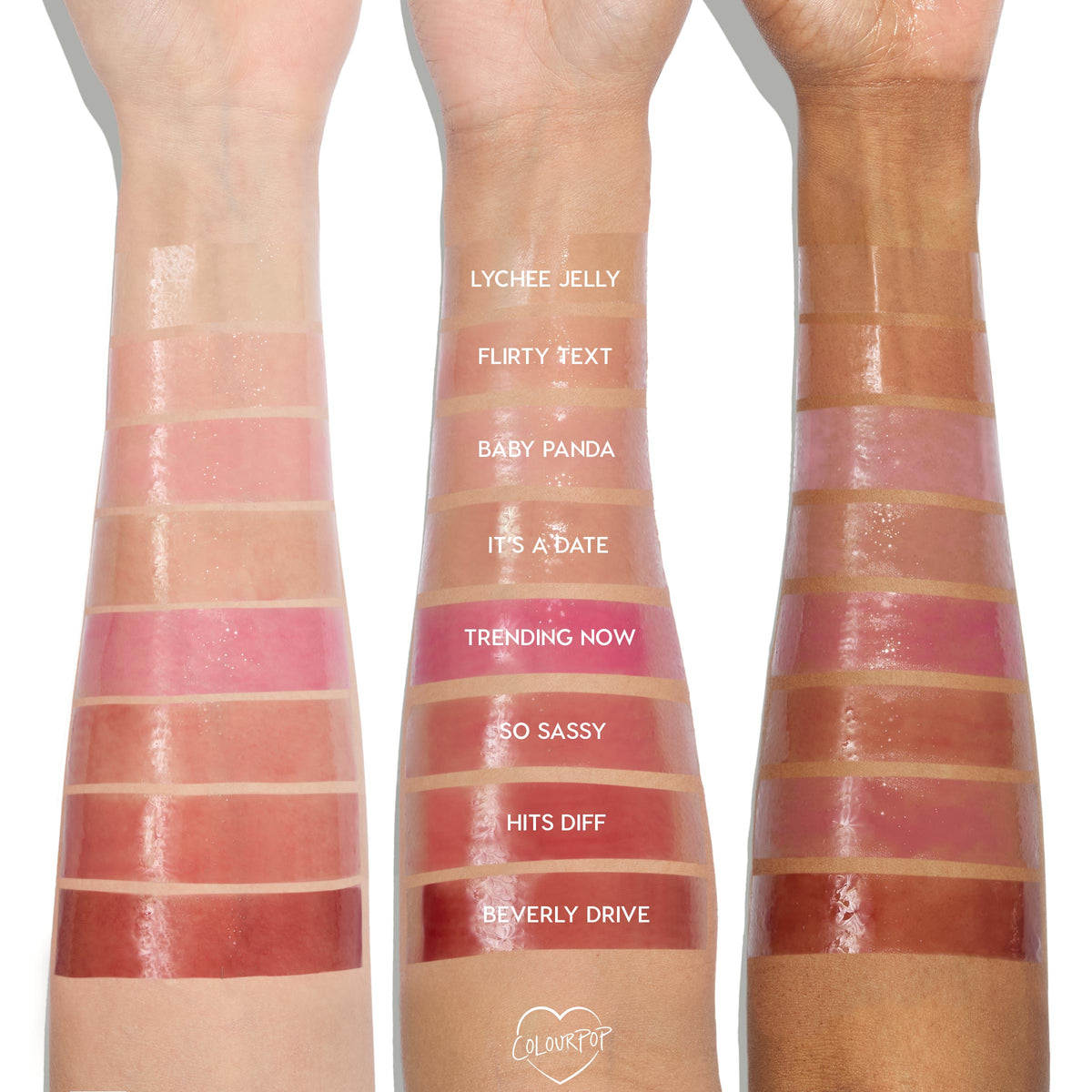Lychee Jelly swatched on three forearms from light to deep skin tones, a sheer glossy pink at the wrist among labeled shades, showcasing the shine and plumping payoff of the ColourPop So Juicy Plumping Glossy Lip Oil.