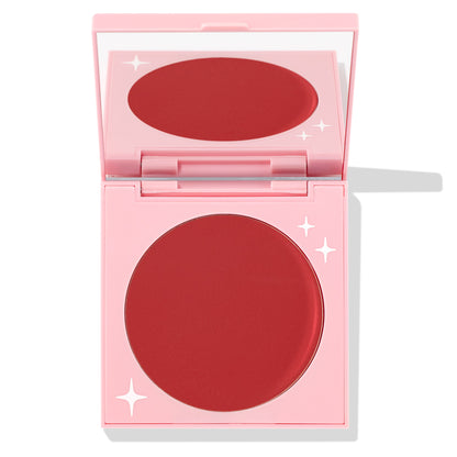 TTYL ColourPop Cream Blush compact revealing a matte deep coral-red pan and mirror, shown half-open in a pastel pink case with white star accents on a clean white background.