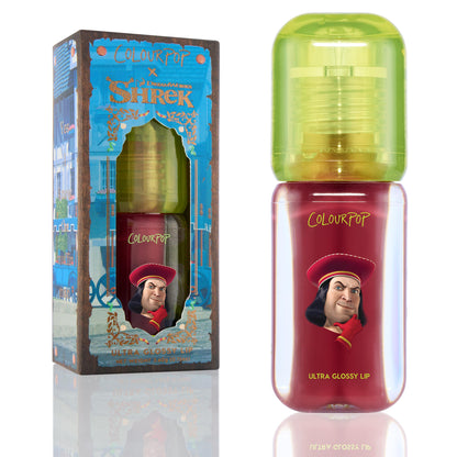 Short Lord ColourPop Ultra Glossy Lip tube stands upright showing deep red gloss in a clear bottle with lime-green cap and Lord Farquaad graphic, placed beside the Shrek collaboration box on a white background.