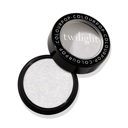 Vampire Skin ColourPop Super Shock Highlighter opens to reveal an icy white micro-shimmer pan in a round black compact with a clear window lid stamped “twilight,” resting on a clean white background.