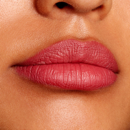 Lips lined and filled with Bumble, a ColourPop Lippie Pencil, displaying a matte rosy-mauve finish and clean, defined edges in a close-up beauty swatch.